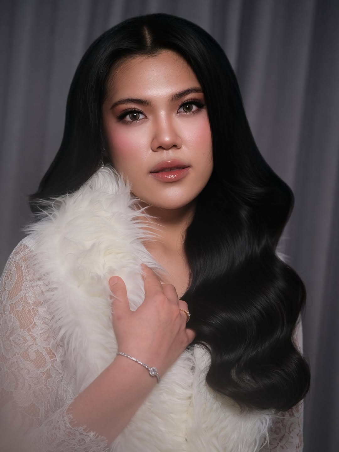 Soft glam bridal makeup with luminous skin and rosy lips