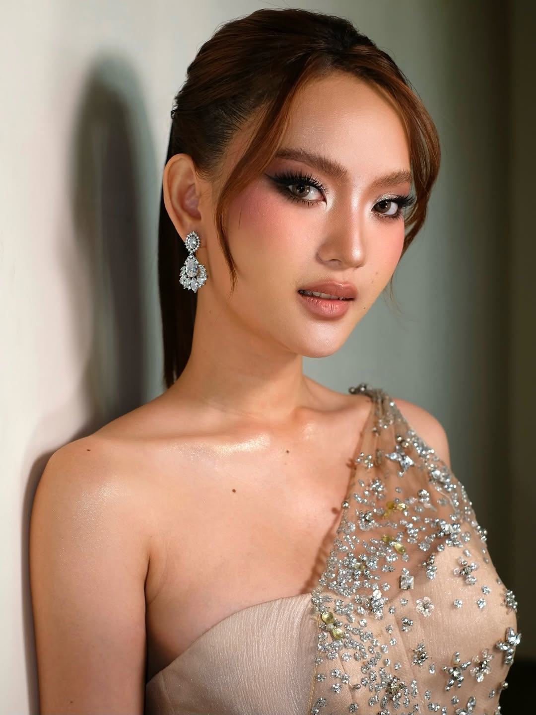 Mother of the bride makeup with subtle shimmer and matte lip